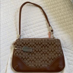 Coach signature wristlet.